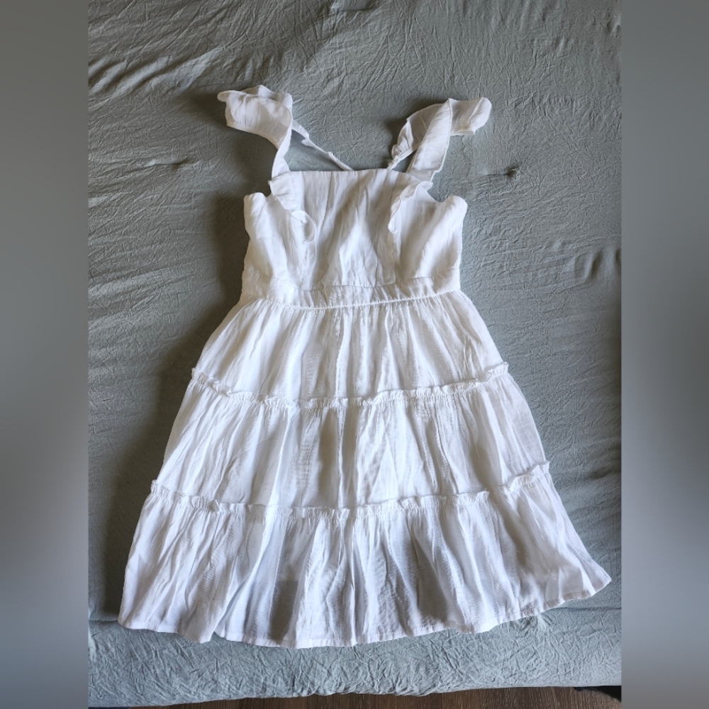 Medium white ruffle cut out back dress